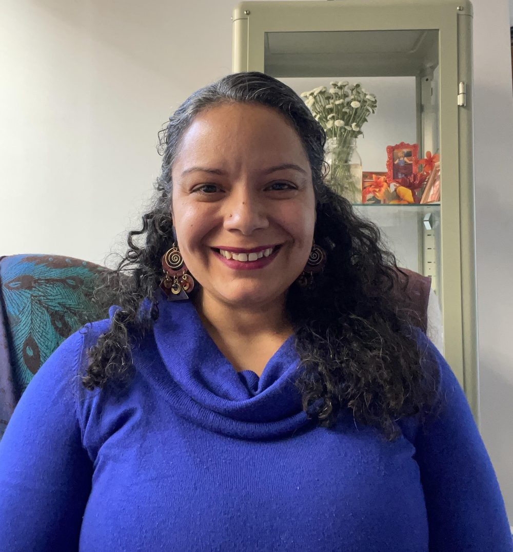 Lauren N. Perez, smiling, seated in her office